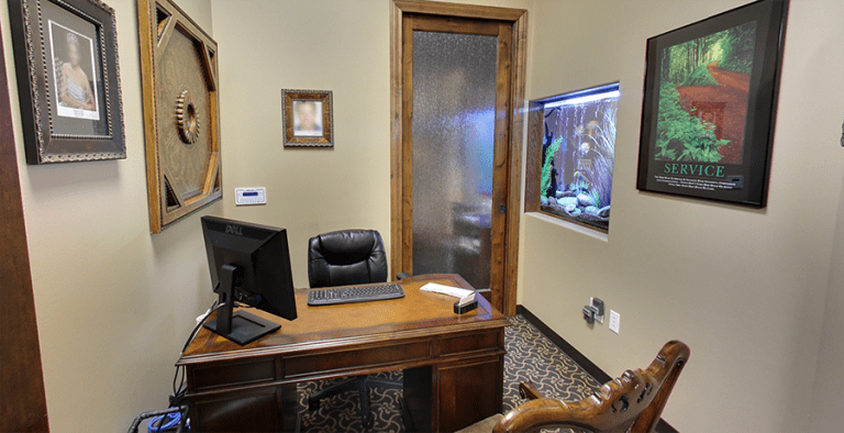 Professional dentist's office showcasing a wooden desk at The Cosmetic Dentists of Austin.